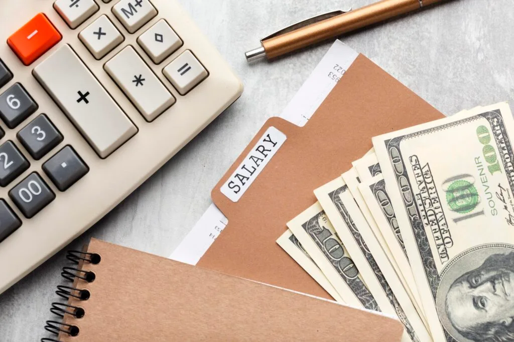 top view payroll concept with cash scaled 1